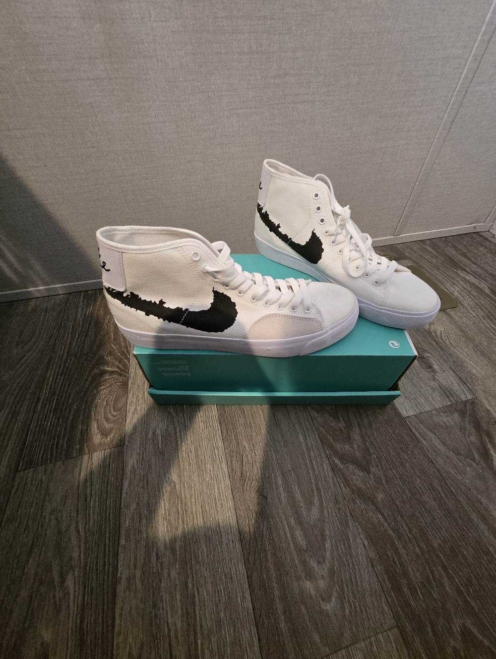 White High-Top Sneakers with Black Swoosh